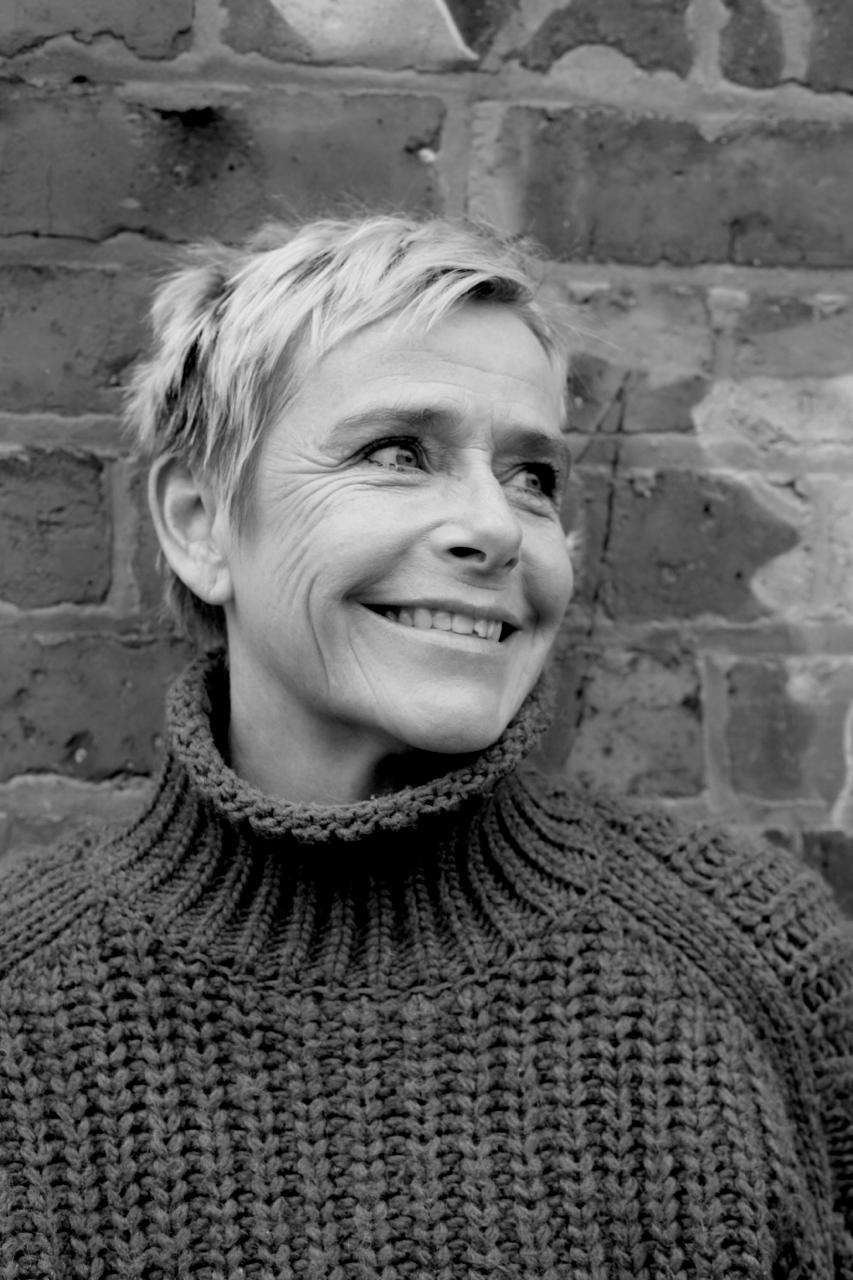 Black and white portrait of Sharon smiling
